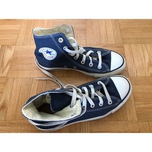 Blue high top converse shoes